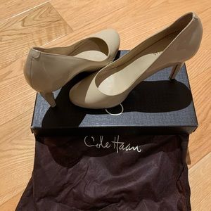 Cream colored Cole Hahn shoes.